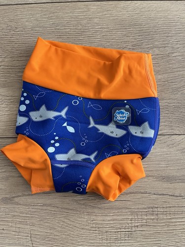 Baby boys splash - about, happy